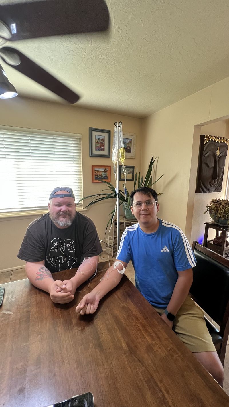 Clients receiving IV therapy together at a home visit