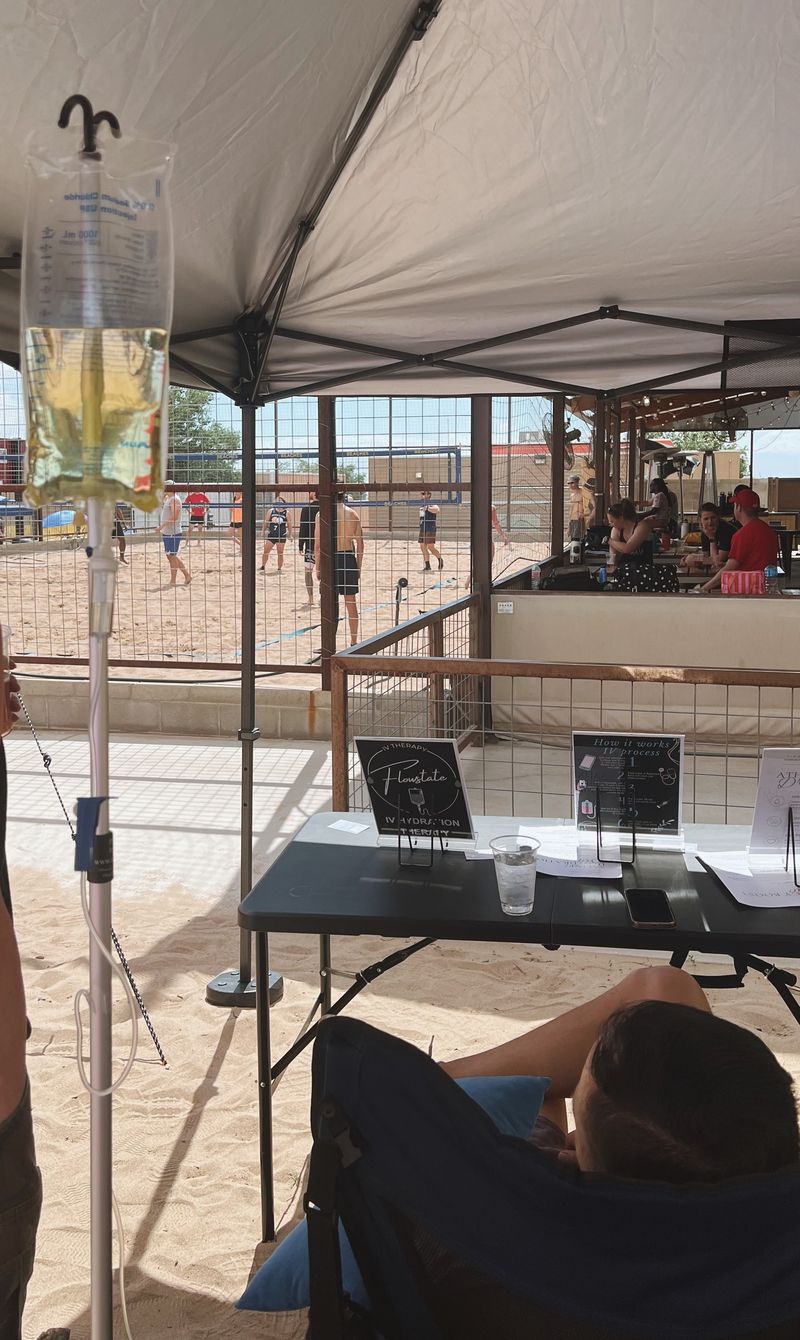 Laticia checking in with a client at a volleyball tournament